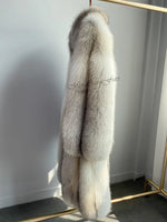 Close-up of plush fawn light fox fur material detail