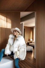 Stylish winter outfit featuring cropped fawn light fox fur jacket