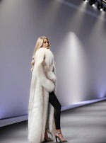Winter luxury look with long fox fur coat in golden beige – floor-length style