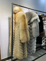 Back view of oversized real fox fur coat for winter