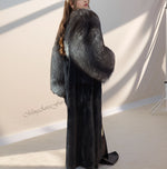 Close-up of natural silver fox fur collar paired with black mink body – rich texture contrast
