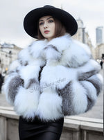Understated luxury winter outfit with black fox fur coat