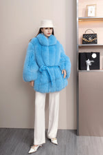 Winter look featuring pure white real fox fur coat with thick, soft texture